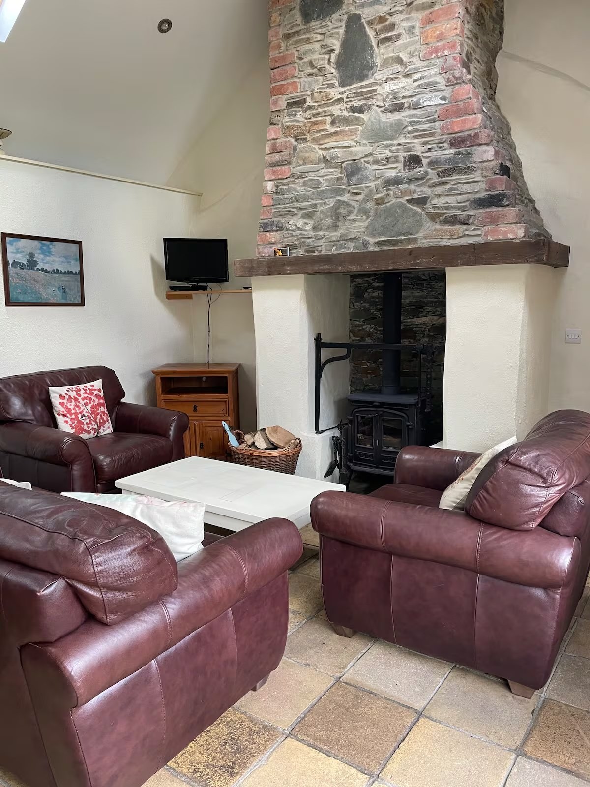 Living room and stove in Ringcladdy Cottage